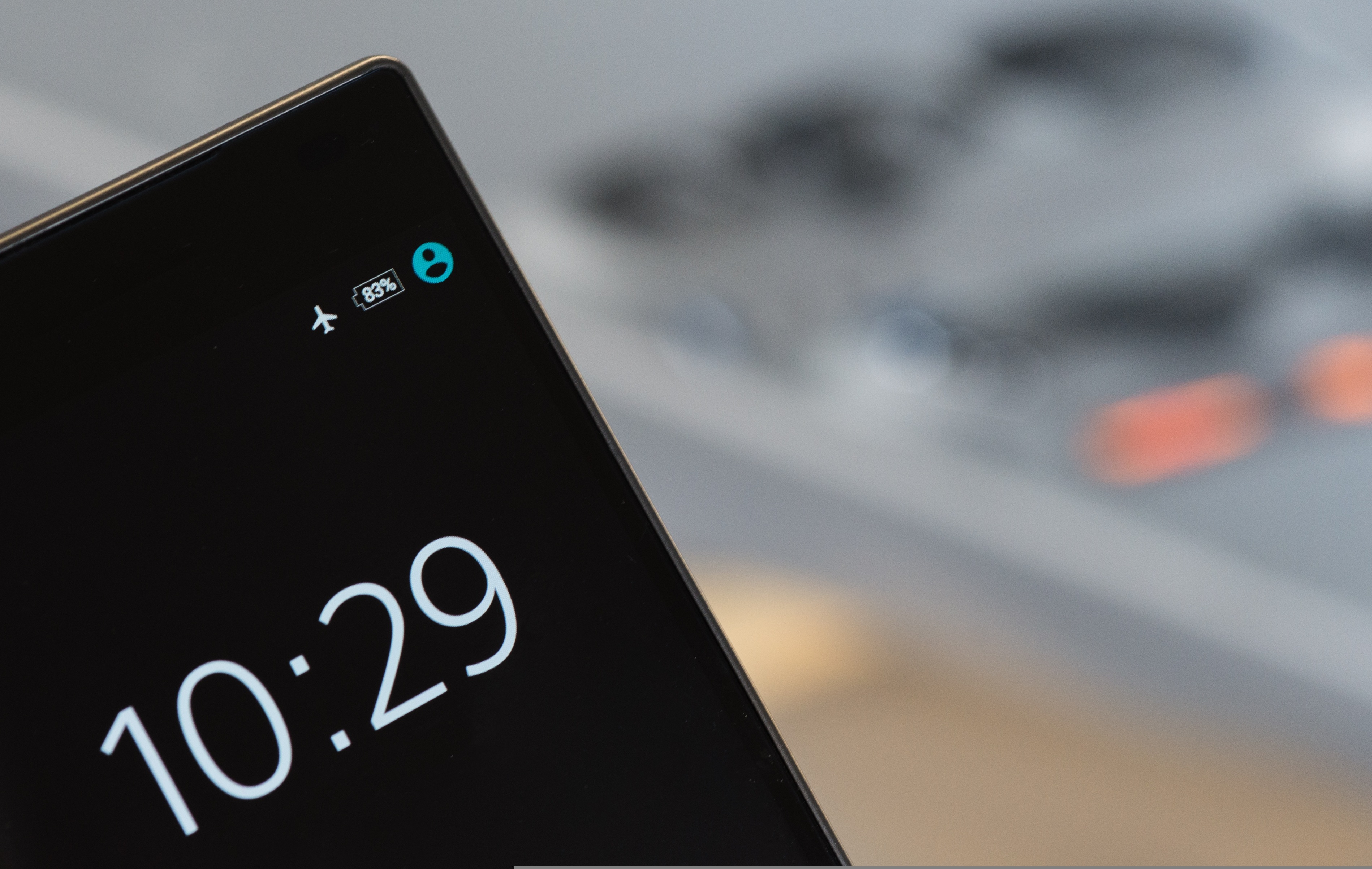 Close-up of a smartphone lock screen showing the time